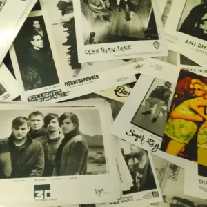 An assorted set of mostly black and white photos featuring the images of various bands and artists.