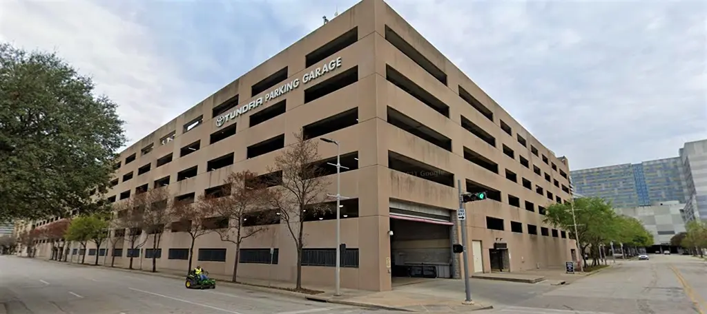 A multilevel parking garage occupying a downtown Houston city block.
