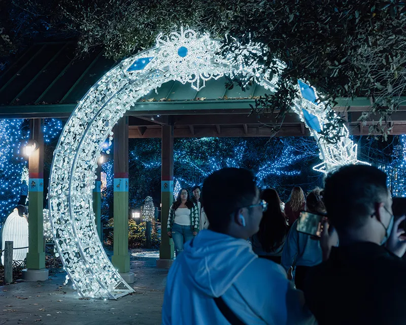 Illuminated archway with festive decorations